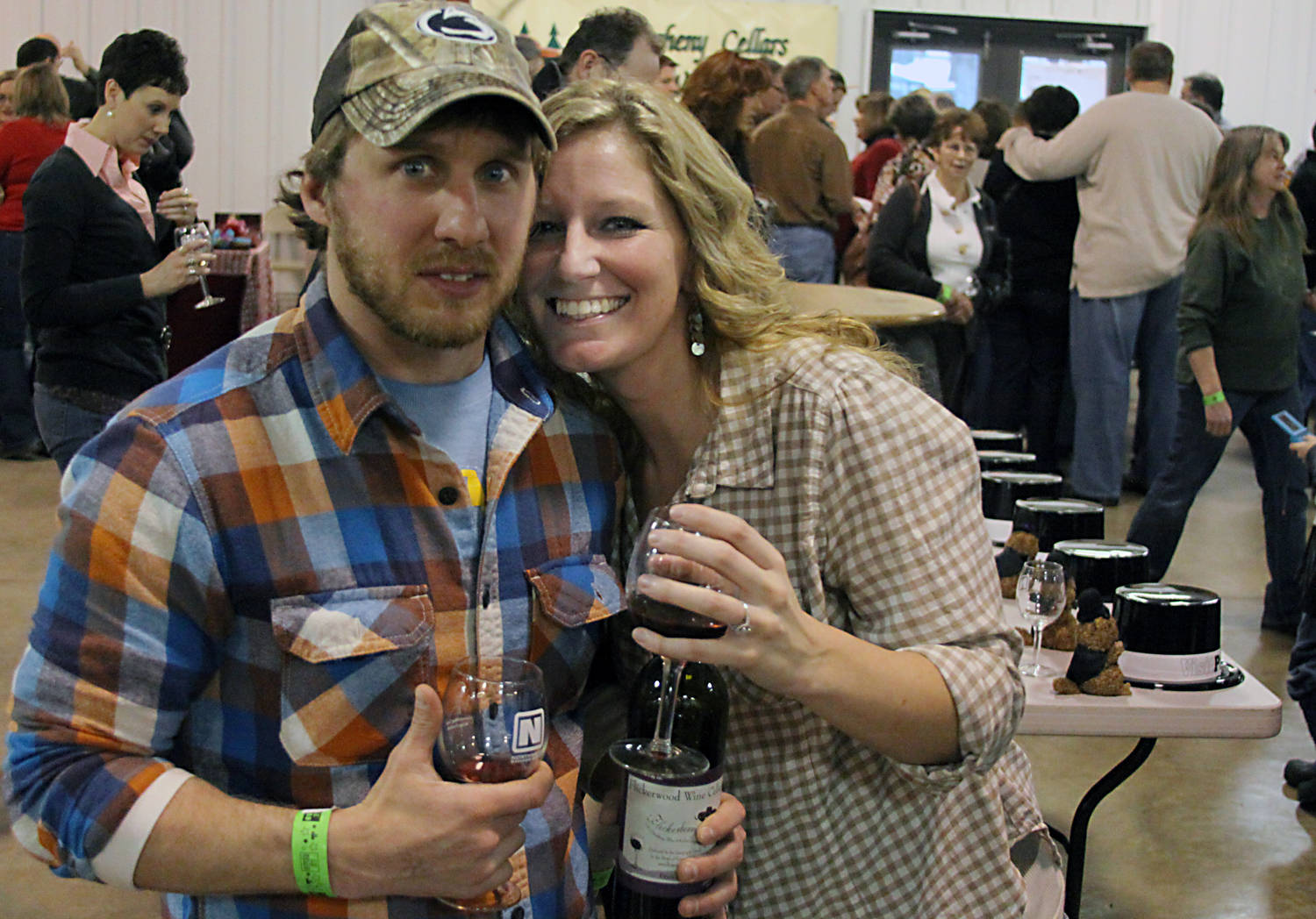 Justin Owens and Sherri Marena, of Woodland, stop enjoying some wine for a moment for a photo.