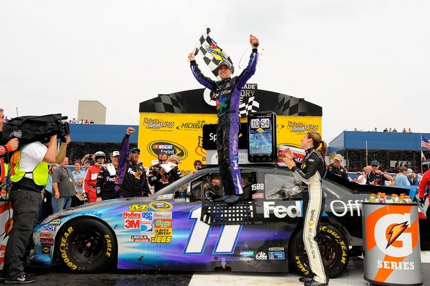 For the first time since Texas last fall, Denny Hamlin celebrates in victory lane at Michigan after his win Sunday afternoon.