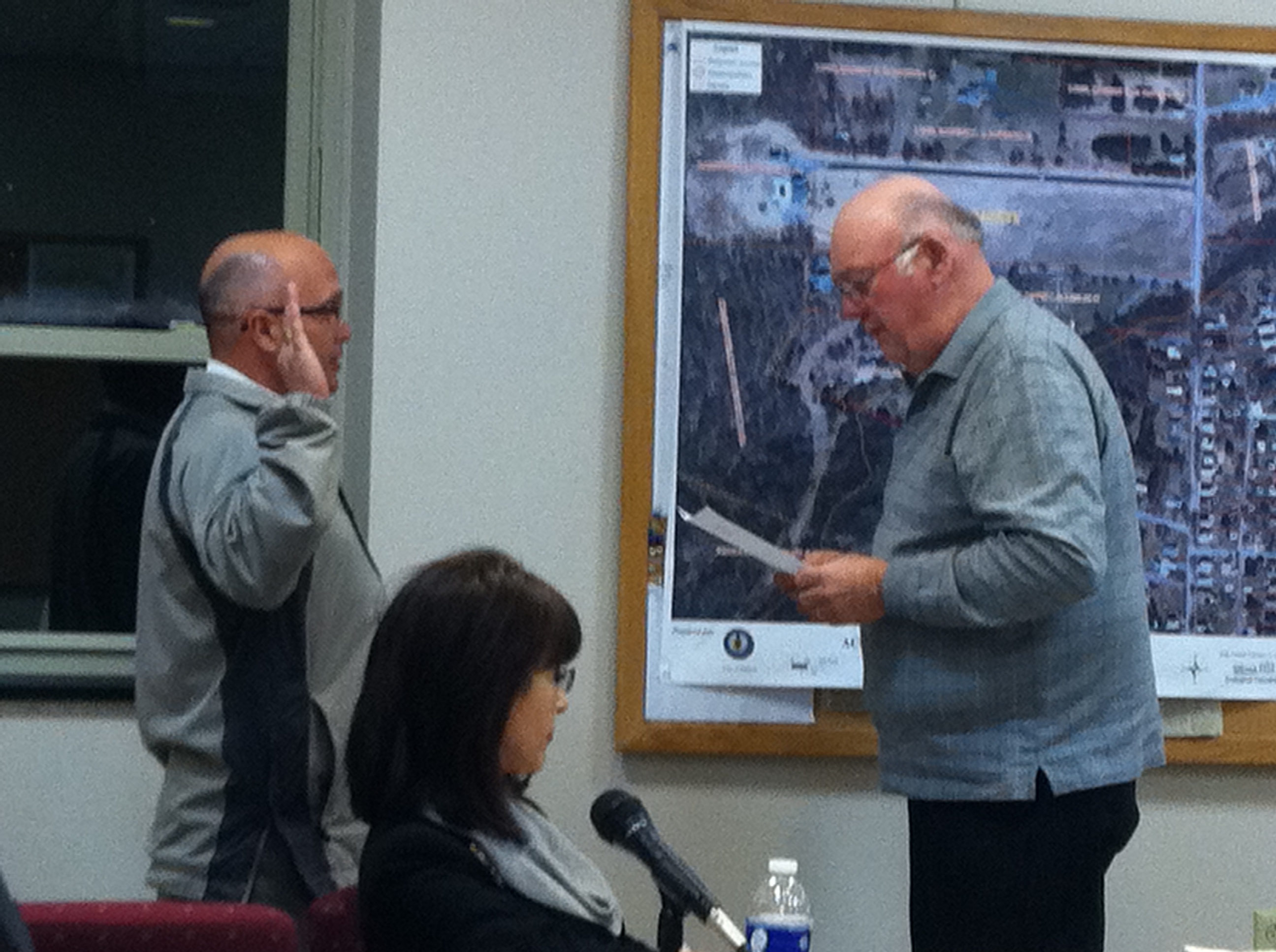 Councilmember Jim Aughenbaugh gets sworn in by DuBois Mayor Gary Gilbert.