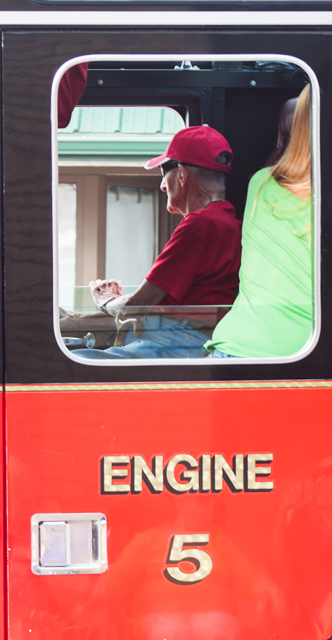 A passenger of a DuBois' Goodwill station engine looks out at the crowd.