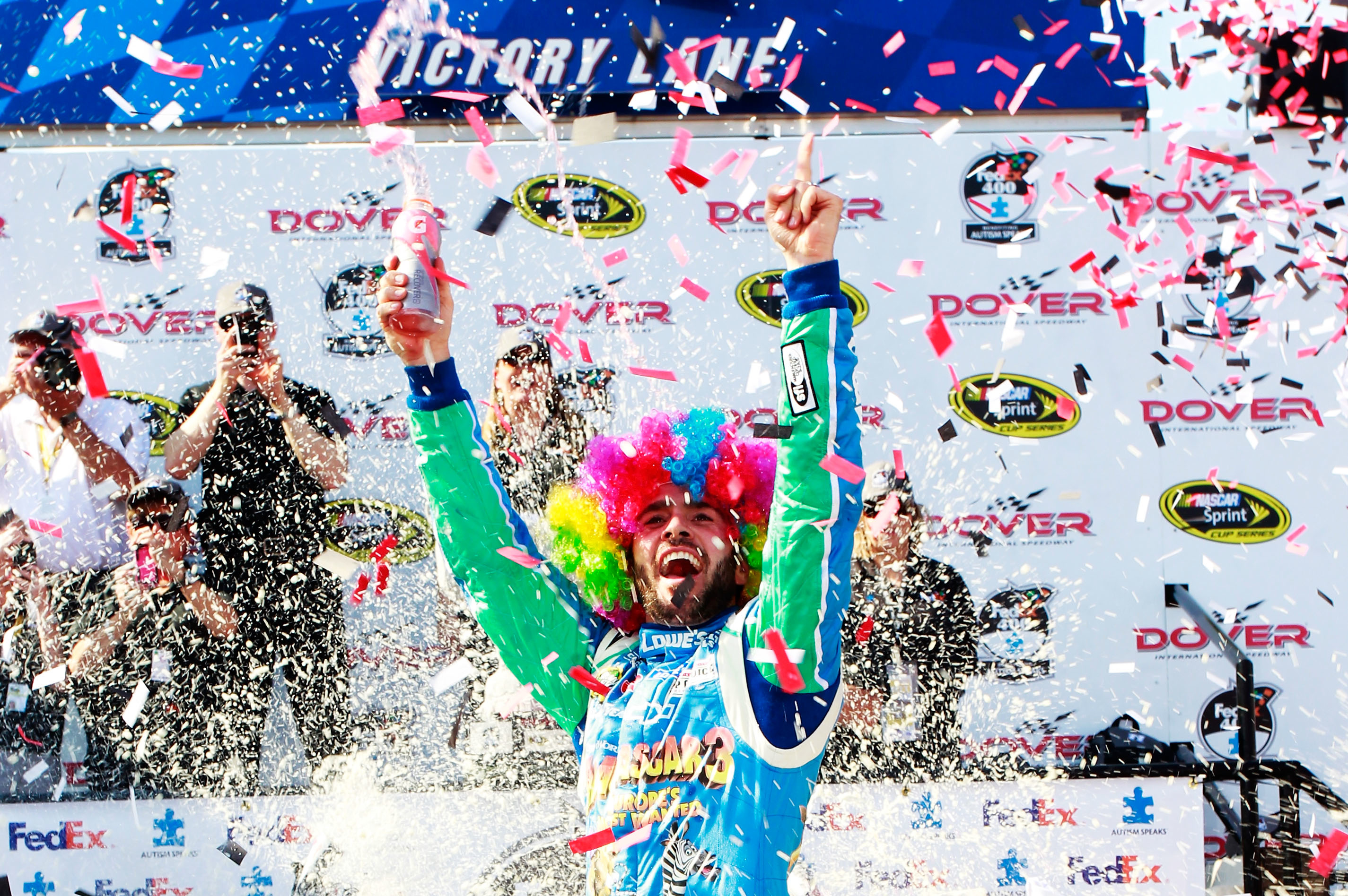 The new Madagascar 3 movie was portrayed on Jimmie Johnson's car at Dover.  It led him to victory, meaning some unique headwear in victory lane.