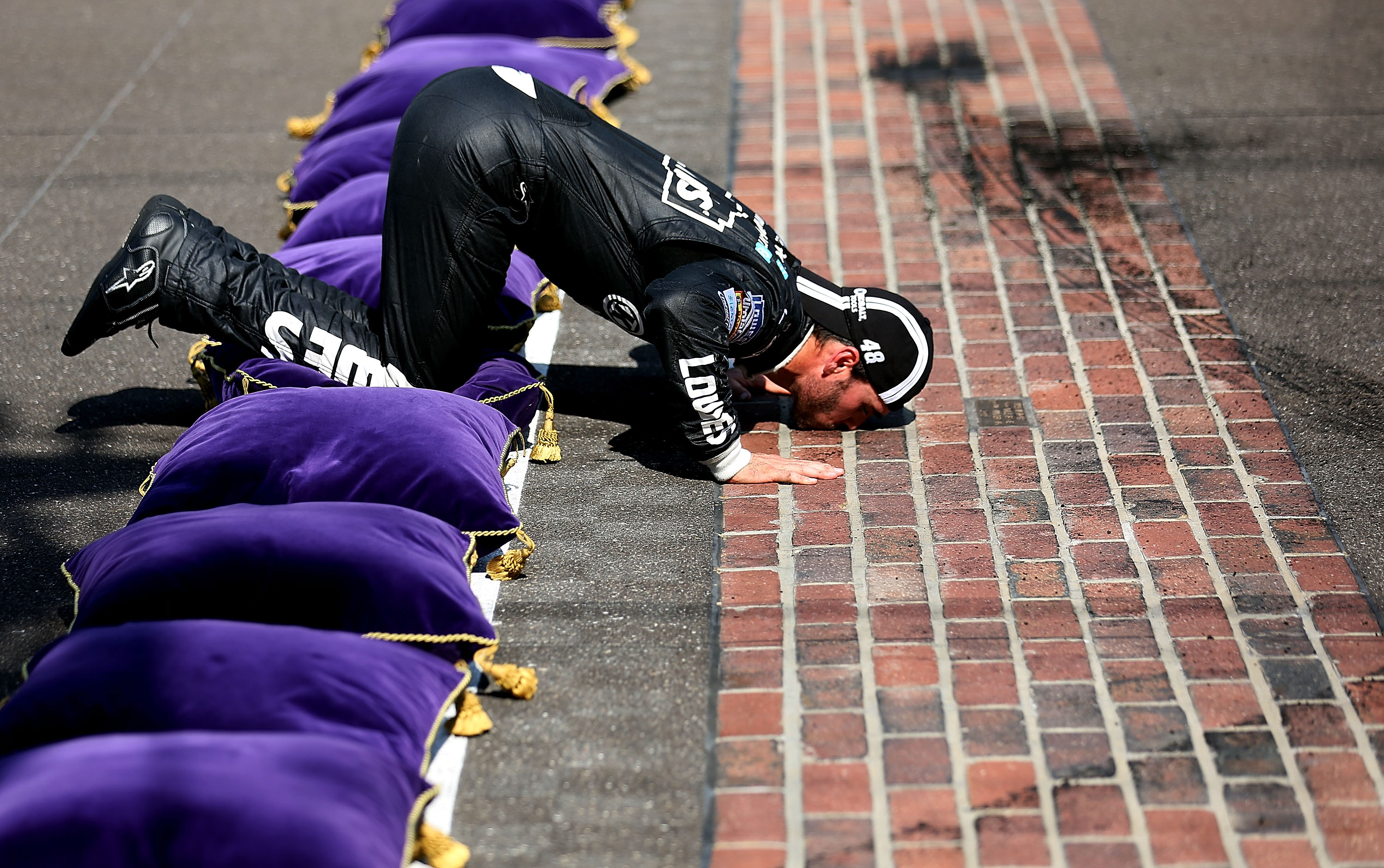 It may be one of the nastiest tasting kisses one can have, but it's also one of the sweetest.  Jimmie Johnson, for the fourth time in his career, got to kneel down and kiss the yard of bricks after winning at Indianapolis on Sunday.
