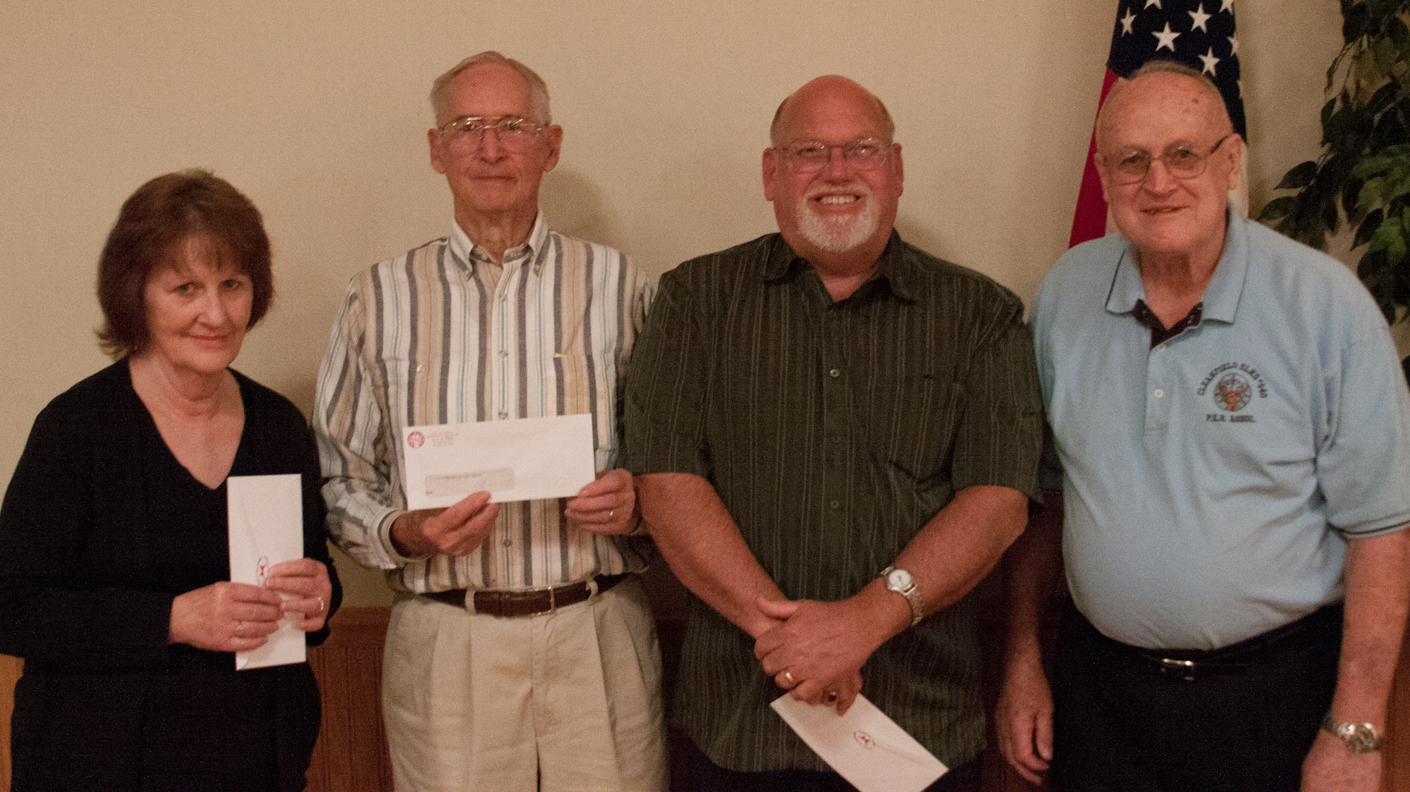 Pictured are organization representatives that received donations. From left to right, the reps are from CAST, Curwensville Civic Center, Clearfield EMS and Elks member Duane Berry, who presented this set of envelopes.