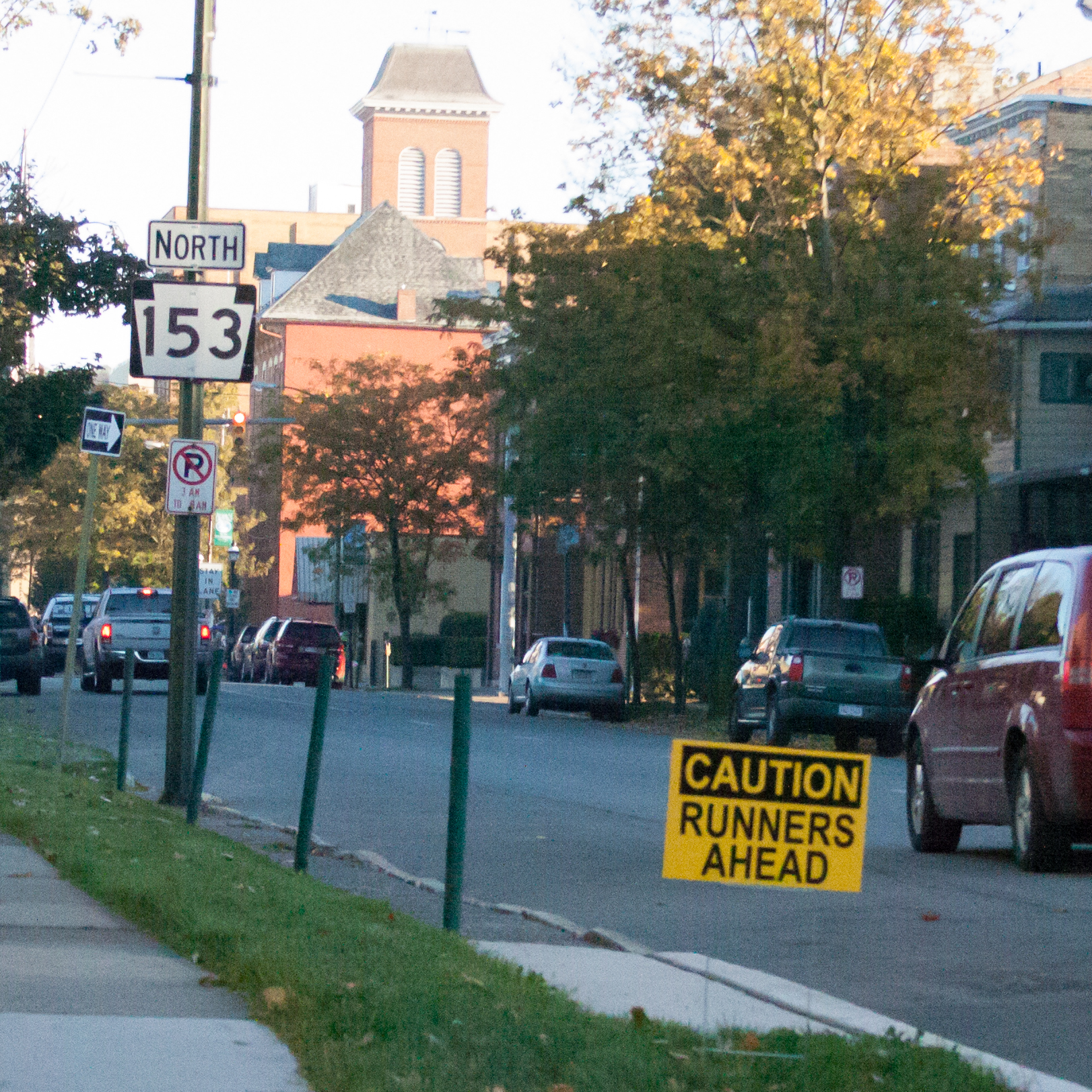 Signs were placed along roads ahead of time to warn drivers they would be sharing the roads with runners.