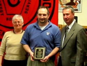 Board President David Glass (center) was presented with a plaque in appreciation for his service on his resignation at Monday’s Clearfield school board committee meeting. Presenting the plaque are Vice President Mary Anne Jackson (left) and Superintendent Dr. Thomas B. Otto (right). (Photo by Theresa Dunlap)