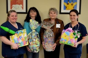 At the Easter basket presentation are (from left): Wendy Hardie, R.N., 5E/5F; Melony Lewis, Warnaco employee; Shirley Hoyne, Foundation for Life, and Danielle Peterman, R.N., 5E/5F. (Provided photo)