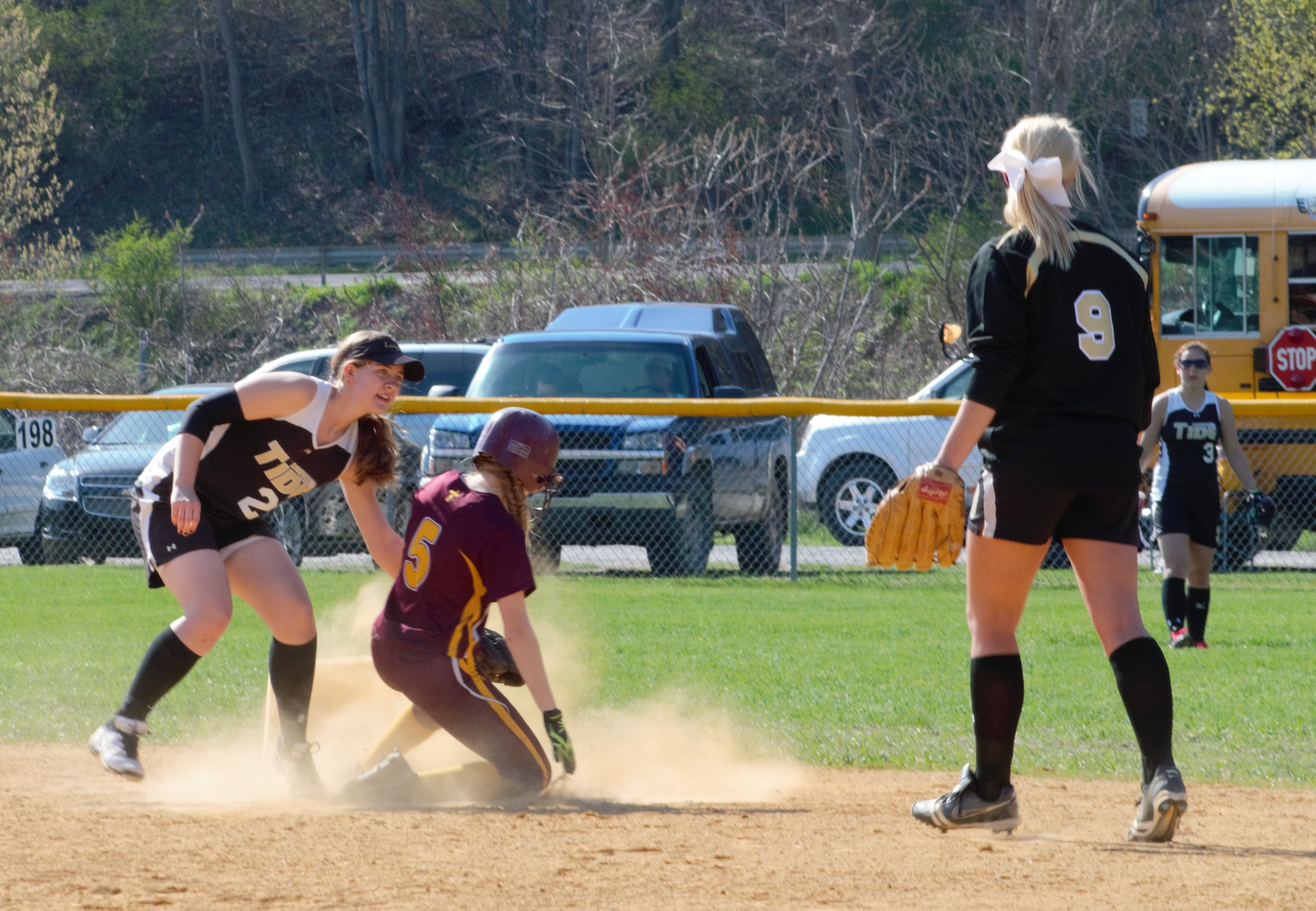 CLOSE AT SECOND - Curwensville shortstop Cheyenne Pentz holds the tage on Elk County Catholic's Maddy Schneider and looks for the call.  Schneider was called safe to help ECC to a 5-0 vidctory.  Second baseman Taylor Goodman (9) and leftfielder Abby Johnson look to back up the play. (photo by Rusty McCracken)