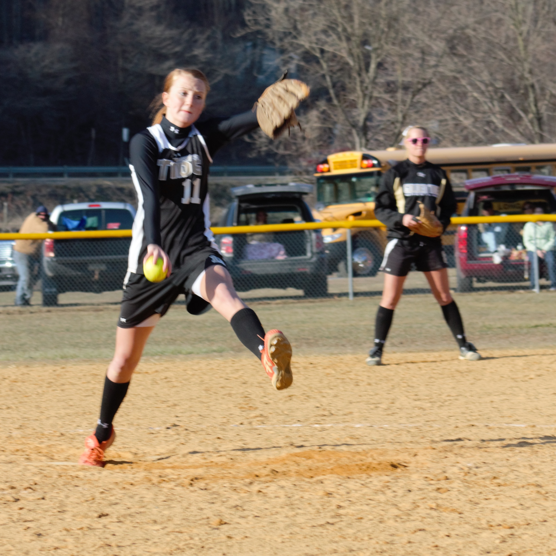 READY TO WHIRL - Curwensville junior Tierra Shope focus on the plate as she starts her windmill delivery and second baseman Taylor Goodman sets her defense against West Branch.  Shope and the Lady Tide downed the Warriors 4-3 on Friday.  (photo by Rusty McCracken)