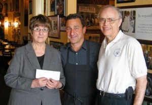 Ed Tate (center) of Luigi’s Ristorante presented a check for $312 to DuBois Area Historical Society President Ruth Gregori (left) and Second Vice President Tom Schott. The restaurant hosted a “Dining for a Cause” fundraiser for the society.  A basket auction and sale of society items raised the total for the day to $511. (Provided photo)