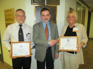 Clearfield Hospital President Gary Macioce, center, congratulated staff members Brad Anderson, facilities director, left, and Cindy Reed, support services director, for earning certification as emergency response trainers. The pair recently completed training offered by the Center for Domestic Preparedness in Anniston, Ala.  (Provided photo)