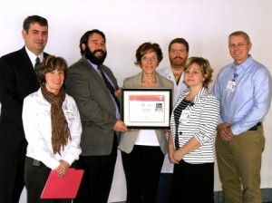 Janet Ashurst (center) accepts the Get With The Guidelines(r)-Stroke Gold Plus Quality Achievement Award from Steve Dentel of the American Heart Association. Other members of the stroke team attending are (from left): Mike Corso, administrative director, Radiology/Cardiology/Stroke/Vascular; Debbie Fornwalt-Beiswenger, administrative assistant; neurologist Joseph Clark, M.D., Blair Medical Associates Neurology; Christine Dively, R.N., Blair Medical Associates and Greg Madison, RRT, manager, Neuroscience/Stroke program.