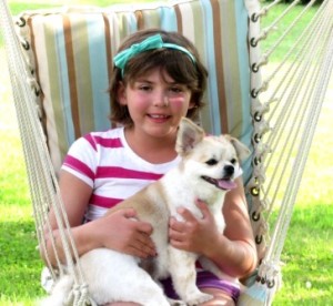 Emily Whitehead enjoying her summer vacation with her dog, Lucy. (Photo by Theresa Dunlap)