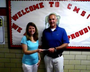 Jana Davidson, 4-H Youth Development Educator for the Penn State Extension and Clearfield County Progressive Agriculture Safety Day Coordinator, accepts a donation on June 7 from Clearfield Area Middle School teacher, Joe Ryan. (Provided photo)