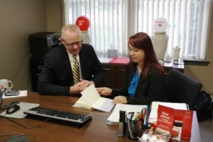 State Farm Agent Greg Cranmer and Penn State DuBois Assistant Director of Student Affairs Marly Doty discuss Daniel Hernandez's book, They Call Me a Hero: A Memoir of My Youth.  (Provided photo)