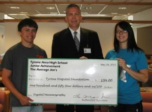 Pictured are representatives of the Average Joe’s Junior Achievement group at Tyrone Area High School, as they present a $154 donation to the Tyrone Hospital Foundation for digital mammography. Pictured, from left to right, are Joe Gearhart, president of the Average Joe’s, Stephen Gildea, chief executive officer at Tyrone Hospital and Morgan Taylor, vice president of Finance of the Average Joe’s.  (Provided photo) 