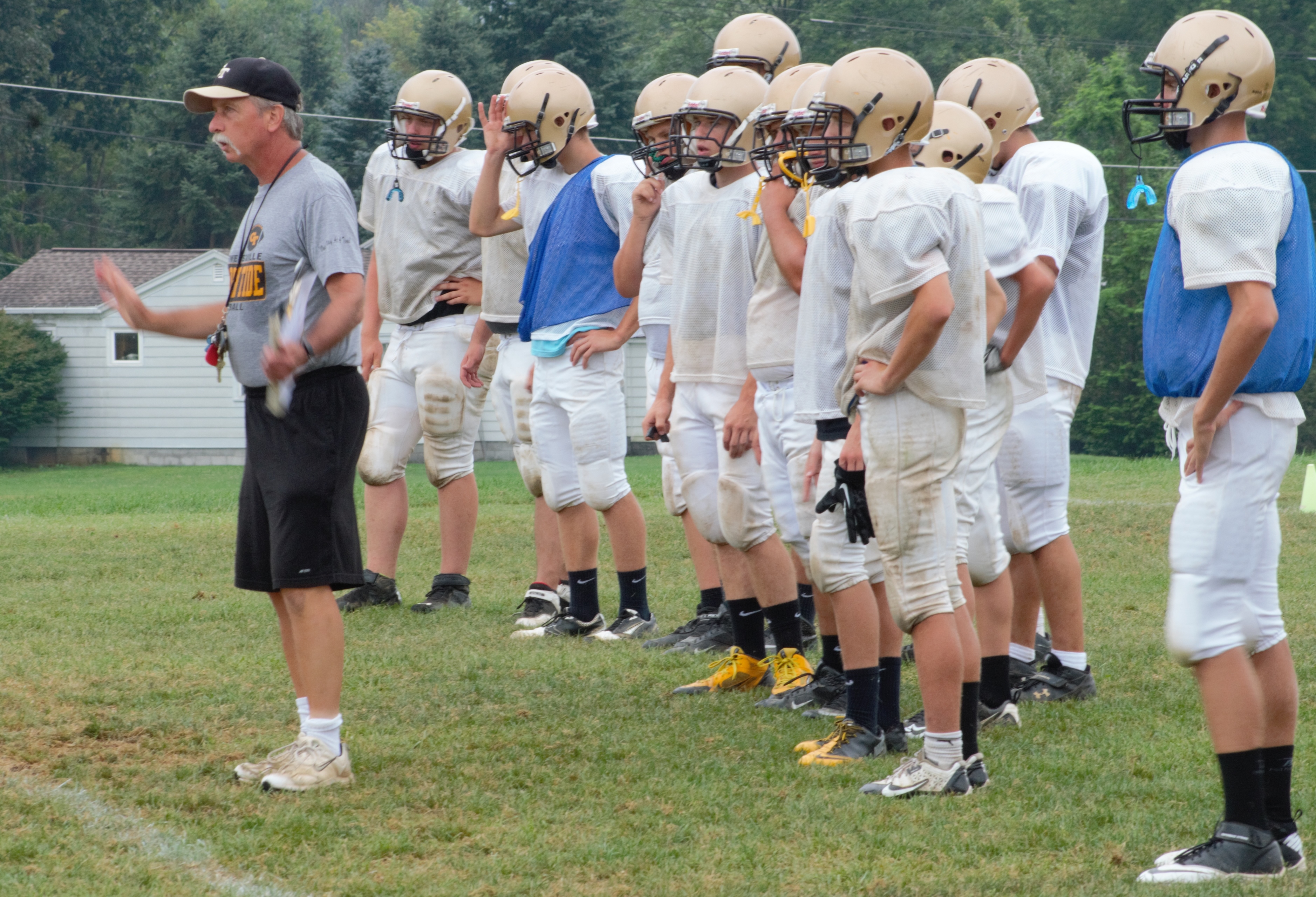 MAKING ADJUSTMENTS during pre-season practices is Curwensville Area head coach Andy Evanko.  (photo by Rusty McCracken)