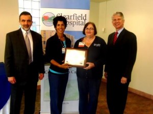 The Clearfield Hospital was applauded for its “A Culture of Always” Program and presented with a HAP 2013 Achievement Award on Wednesday. Shown, from left, are Gary Macioce, president of Clearfield Hospital; Dolores “Dee” Hanna, R.N., education manager; Kathy Baumgratz, R.N., medical/surgical director; and Andy Carter, president and Chief Executive Officer of The Hospital and Healthsystem Association of Pennsylvania. (Photo by Jessica Shirey)