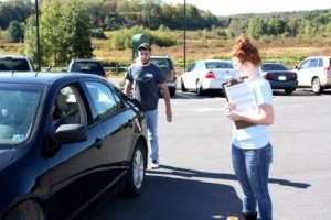 Student Shane Thomas checks a driver's visibility in their rear view mirrors while classmate Ashley Barr looks for ways to adjust the mirrors for improved visibility. The goal is for the driver to be able to see how many fingers Shane is holding outward. (Provided photo)