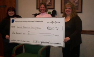 Vicki Myers, Clearfield County Charitable Foundation board member, right, presents a $1,000 check to Robin Clark a representative of area food banks, left, and Connie Harris of Central Pennsylvania Community Action for their Carnation Instant Breakfast program which is distributed through area food pantries to individuals with nutritional deficiencies. The program benefits cancer patients, seniors, pregnant women and others. (Provided photo)