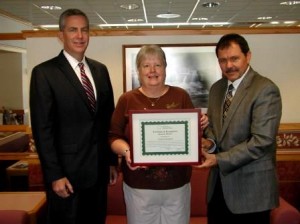 Tyrone Hospital received special honors from the National Rural Health Resource Center for excellence and innovation in the area of community engagement. The award was presented to Tyrone Hospital leaders by Larry Baronner, Critical Access Hospital coordinator at the Pennsylvania Office of Rural Health. Pictured left to right with the award is Stephen Gildea, chief executive officer at Tyrone Hospital, Kelly Wike, president of Tyrone Hospital Board of Directors and Baronner. (Provided photo)