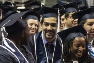 Seniors in Penn State's College of Earth and Mineral Sciences react as their degrees are conferred by Penn State President Rodney Erickson, declaring them graduates of the Pennsylvania State University. (Provided photo)