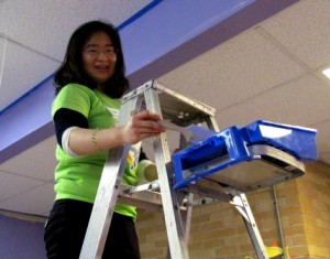 Penn State DuBois Freshman Sichen Li applies fresh paint to the interior of the Children's Center of Mercer County during the MLK Day of Service.  (Provided photo)