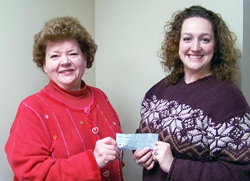 Jeanne Urban (left) representing the Clearfield’s Woman’s Club is shown presenting a $100 check to Rikki Ross (right), director of Planning and Marketing for the Clearfield County Area Agency on Aging Inc. (Provided photo)