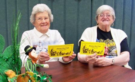 Clearfield Center for Active Living volunteers Eleanor Peters and E. Ann Reid are shown displaying the new booklet of the Spring Dining Out Club, which begins this month. (Provided photo)