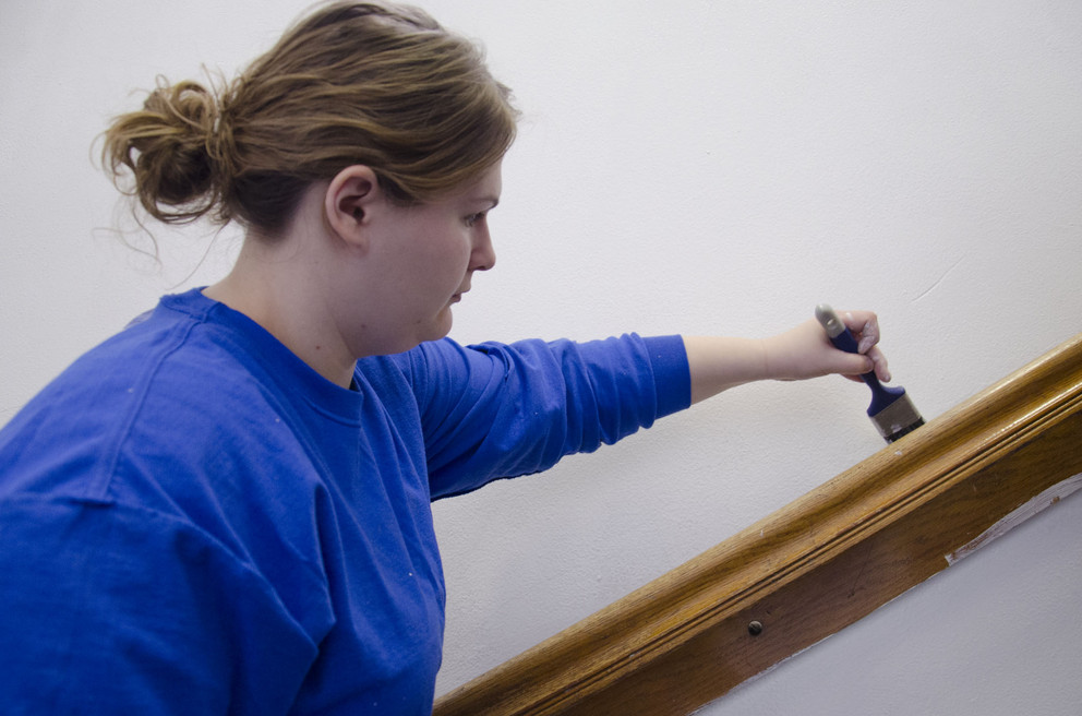 Lindsay Stoffer, a sophomore from Spring Mills, painted walls at the State College School District's 154 W. Nittany Ave. location March 1 as part of the State Day of Service. Penn State students from the Delta Theta Sigma and Alpha Zeta agricultural societies were sprucing up areas used by the district's Delta Program. (Provided photo)