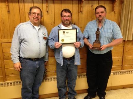 Greg Burkhouse, forest fire specialist supervisor, presents Edward Woods with his 20 years of service award. Also shown is Terry Smith, special investigator, with the Bronze Smokey Award. (Provided photo)