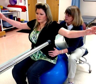 Vicky Nelson (left) works with HealthSouth Physical Therapist Sharon Rose to improve her balance and core strength.  Vicky transitioned from HealthSouth Nittany Valley’s inpatient hospital to the outpatient clinic in Pleasant Gap to continue therapy after a non-traumatic brain injury.  (Provided photo)