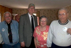 Pictured are Meals Driver Lou Mitchell, Commissioner John A. Sobel and Faye and John Wheeler. (Provided photo) 