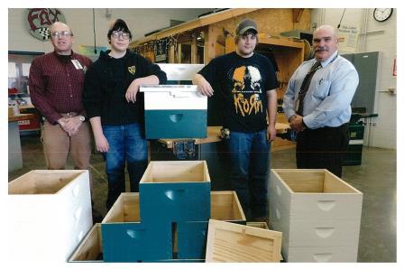 Pictured are Dave Rishell, Jeff Tech Building Trades instructor; Ben Whaley and Collin Whitehouse, Jeff Tech Building Trades students; and Bob Michael, beekeeper. (Provided photo)