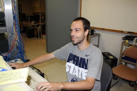 IST Program graduate Cody Weible works on a server in the Penn State DuBois IST Lab.  He will start his position with Amazon.com in August. (Provided photo)