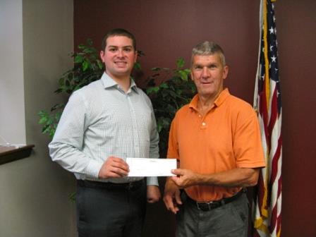 Chris Renaud of the CRC is pictured accepting the check from Bob Knepp, owner of the Ritz Theater. (Provided photo)