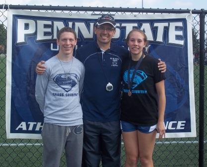 Penn State DuBois Head Cross Country Coach Kyle Gordon, center, with runners Mathew Burke and Juliann Boddorf at the PSUAC Championships. (Provided photo)