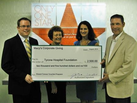 Pictured, at the Macy’s Store at Logan Valley Mall in Altoona in front of Macy’s signature red star, are representatives of Macy’s Altoona store presenting a $2,500 grant to representatives of the Breast Cancer & Women’s Health Institute of Central Pennsylvania. From left to right are Jason Potts, merchandise team manager, Macy’s Altoona store; Marcia Loner, administrative support at Macy’s Altoona store; Lannette Johnston, director of outreach at Tyrone Regional Health Network and the Breast Cancer & Women’s Health Institute; and Murray Fetzer, director of rural health and the Tyrone Fitness and Wellness Center at Tyrone Regional Health Network. (Provided photo)