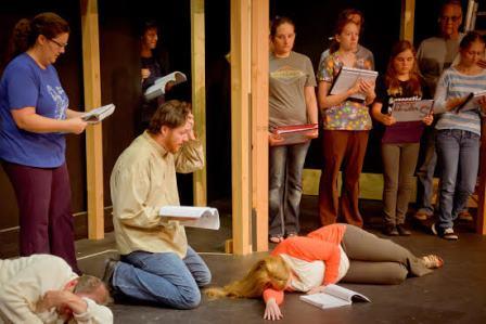 The cast of Sweeney Todd rehearses a dramatic scene at the Reitz Theater in DuBois. Pictured, from left to right, are Kristie Taylor (Mrs. Lovett), Chris Taylor (Sweeney Todd), Charles Brosius (behind Todd), Nicki Cherry, Krista Carr, Jacqueline Spicher, Allan Hewitt and Caitlin Kalgren. (Provided photo)