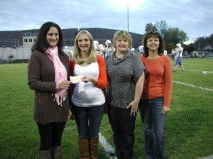 Pictured, from left to right, are Lannette Johnston, director of outreach for the BCWHI and Tyrone Regional Health Network; Noelle Hand, president of the Tyrone football boosters; Amy Case, president of the Tyrone Cheerleader Boosters; and Cris Hunter Tyrone Assistant Cheerleading Coach. (Provided photo)