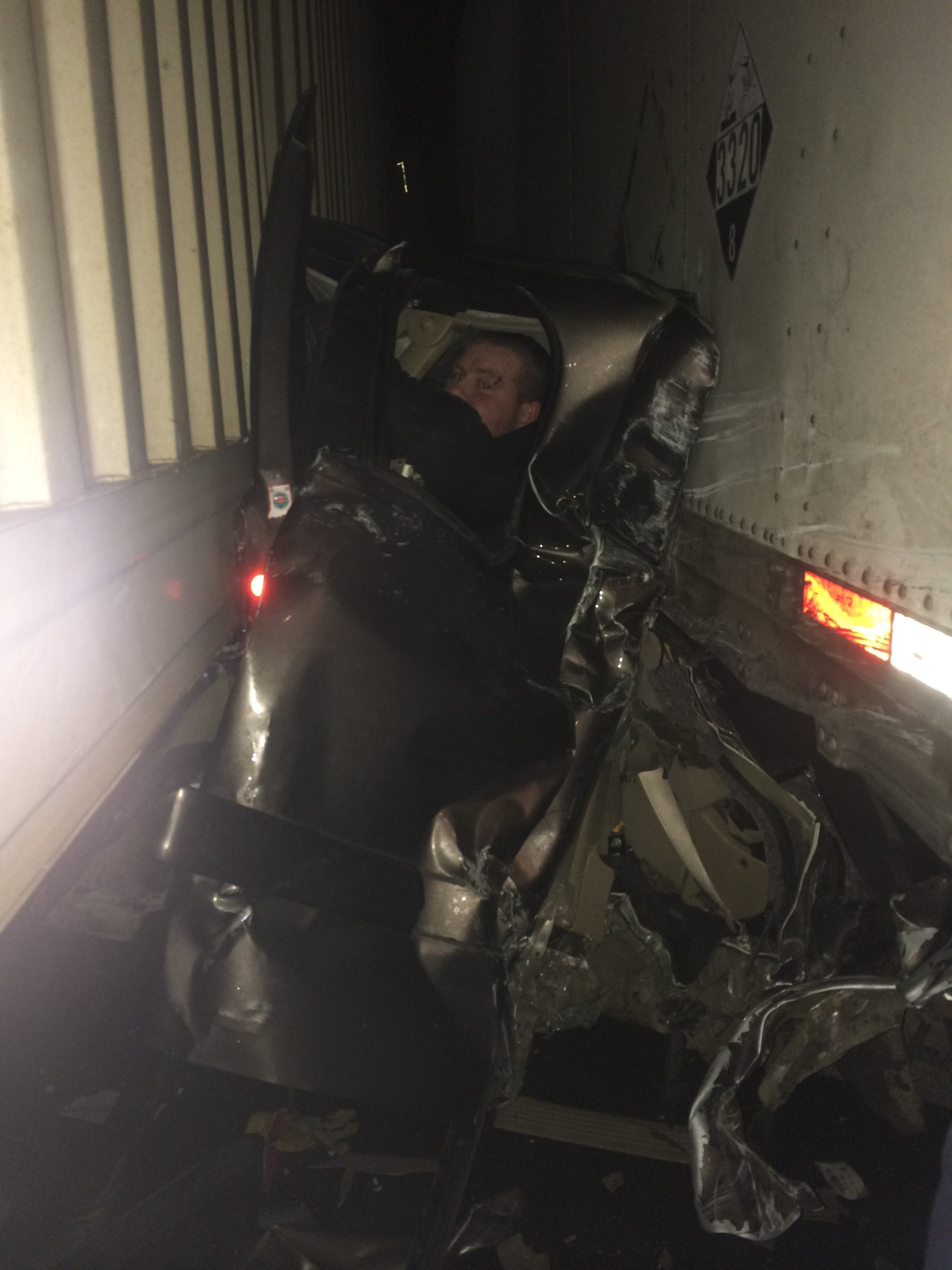 Driver Pinned Between Semi Trucks