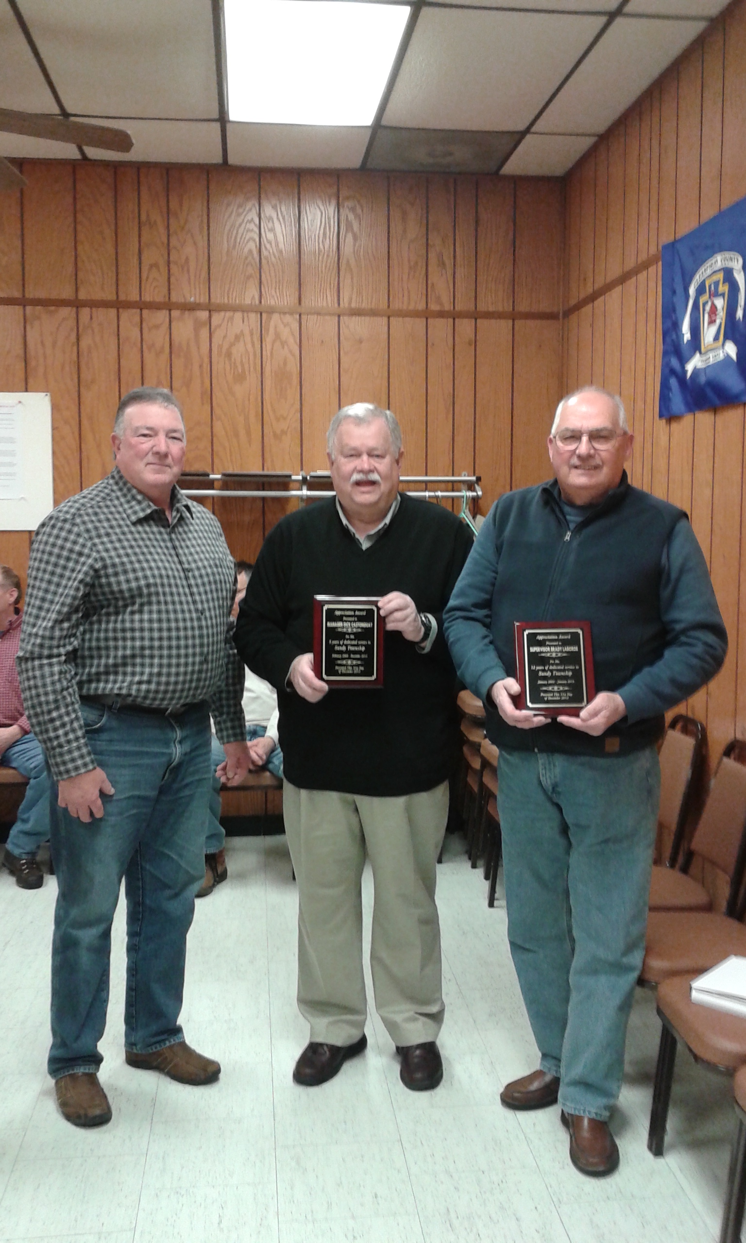 Sandy Township officials presented awards to former Manager Dick Castonguay and former Supervisor Brady LaBorde.  (Photo by Alex Toledo)