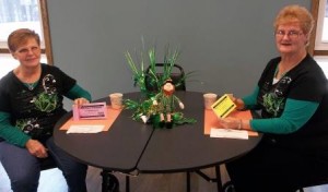 Clearfield Center for Active Living volunteers Sally Ransel and Linda McPherson are shown displaying the new booklet of the Spring Dining Out Club, which begins April 6. (Provided photo)