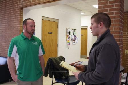Student Tige Woodson, right, interviews entrepreneur Dave Hoare about his experiences as a small business owner. (Provided photo)