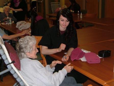 Pictured is Rachel Fisher from the Jeff Tech Cosmetology program with a resident of Christ the King Manor. (Provided photo)