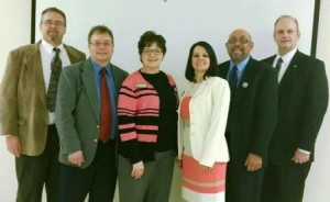 Pictured, from left, are:  Tom Scott, county commissioner candidate; Mark McCracken, incumbent county commissioner seeking re-election; Carol A. Fox, incumbent county treasurer seeking re-election; Trudy Lumadue, county commissioner candidate; Pastor Bob Henry; and William A. Shaw Jr., incumbent District Attorney seeking re-election. (Provided photo)