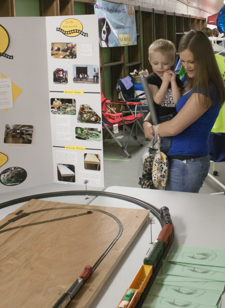 A Clearfield Model Railroad Club setup delights a child.