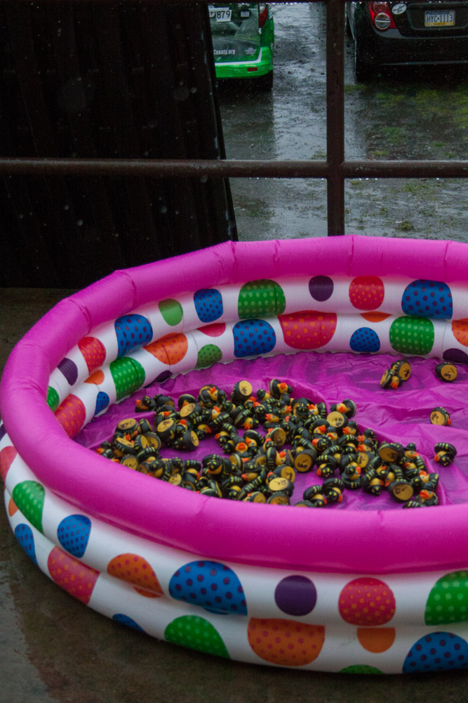 The rubber duck lottery pool was relocated outside into the rain to make room for guest sitting.