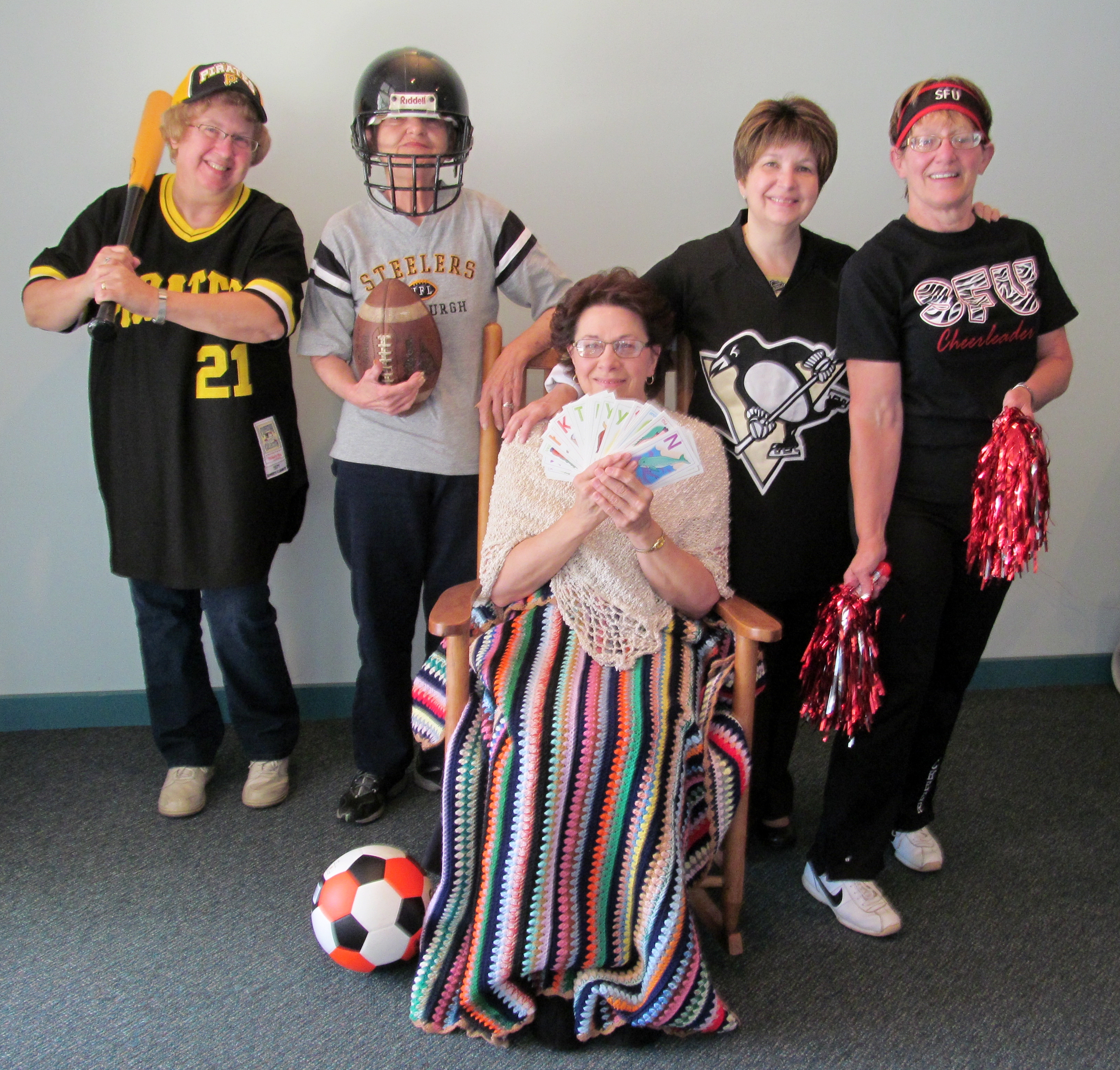 Dressing in accordance with the theme, “Game On,” are, from left, Karen Warfield, registered nurse and director of home health and hospice; Donna Neff, hospice volunteer; Janice Holt, hospice aide; Joyce Wisor, RN, hospice quality manager; and Marie McGovern, hospice medical secretary. (Provided Photo)