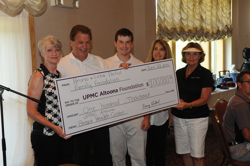 Dianna Craig, M.D. (left), a surgeon who specializes in breast diseases at the UPMC Altoona Breast Health Center, accepts a check for $100,000 from the Bruno and Lena DeGol Foundation represented by Denny DeGol (second from left) and his son Anthony DeGol. With them are Karen Pfeffer, Esq., (second from right) capital campaign committee chairperson, and Ann Benzel, representing the UPMC Altoona Foundation board of directors. (Provided Photo)