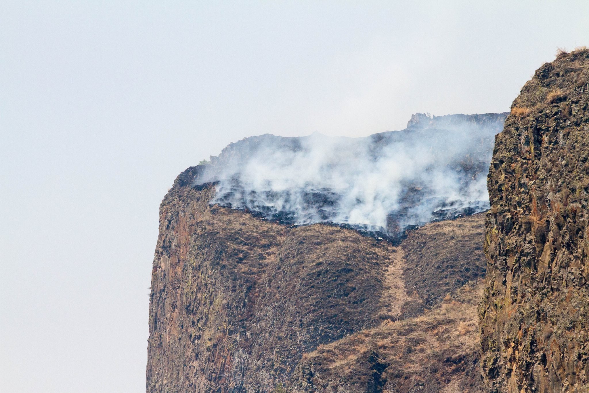 Photos from the Idaho Department of Lands show a large wildfire spreading through northern Idaho, threatening the town of Kamiah on August 17, 2015